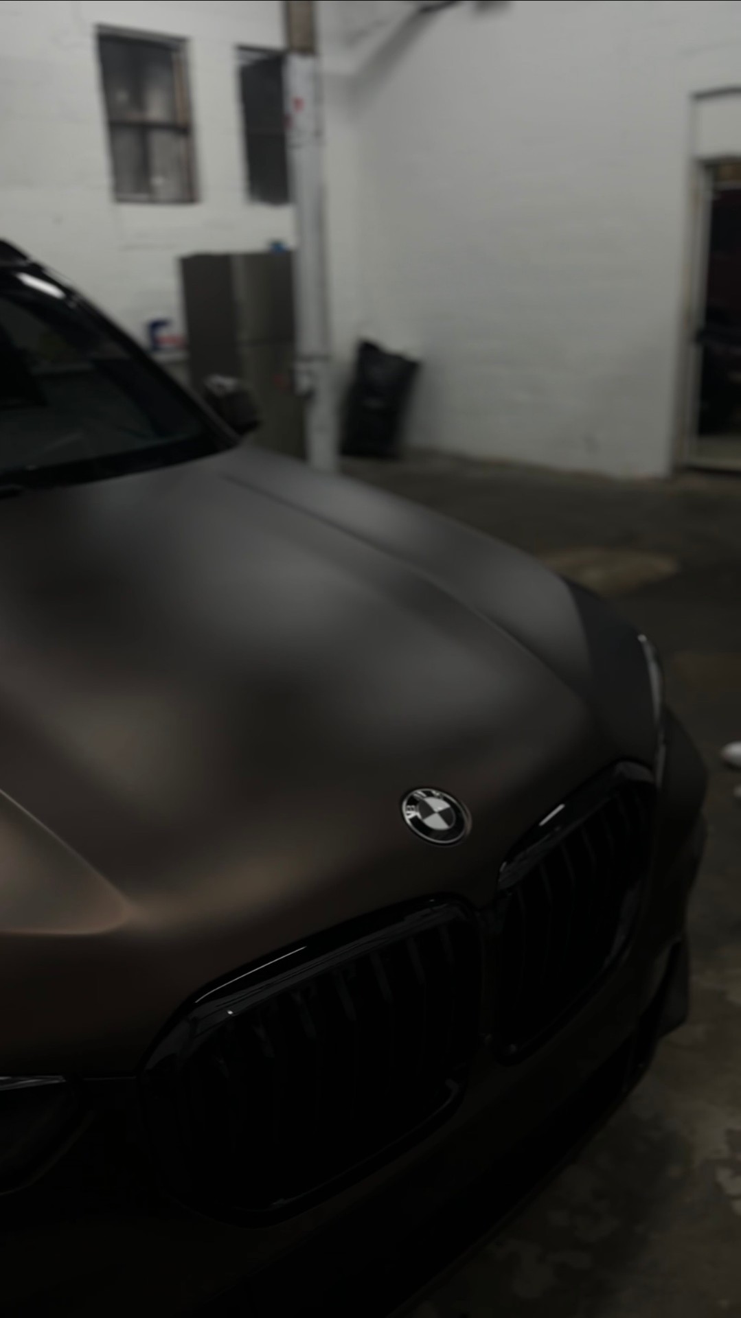 The Wrap Grid installer detail work on a wrapped vehicle